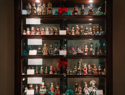 Collector cabinet of folk art figurines
